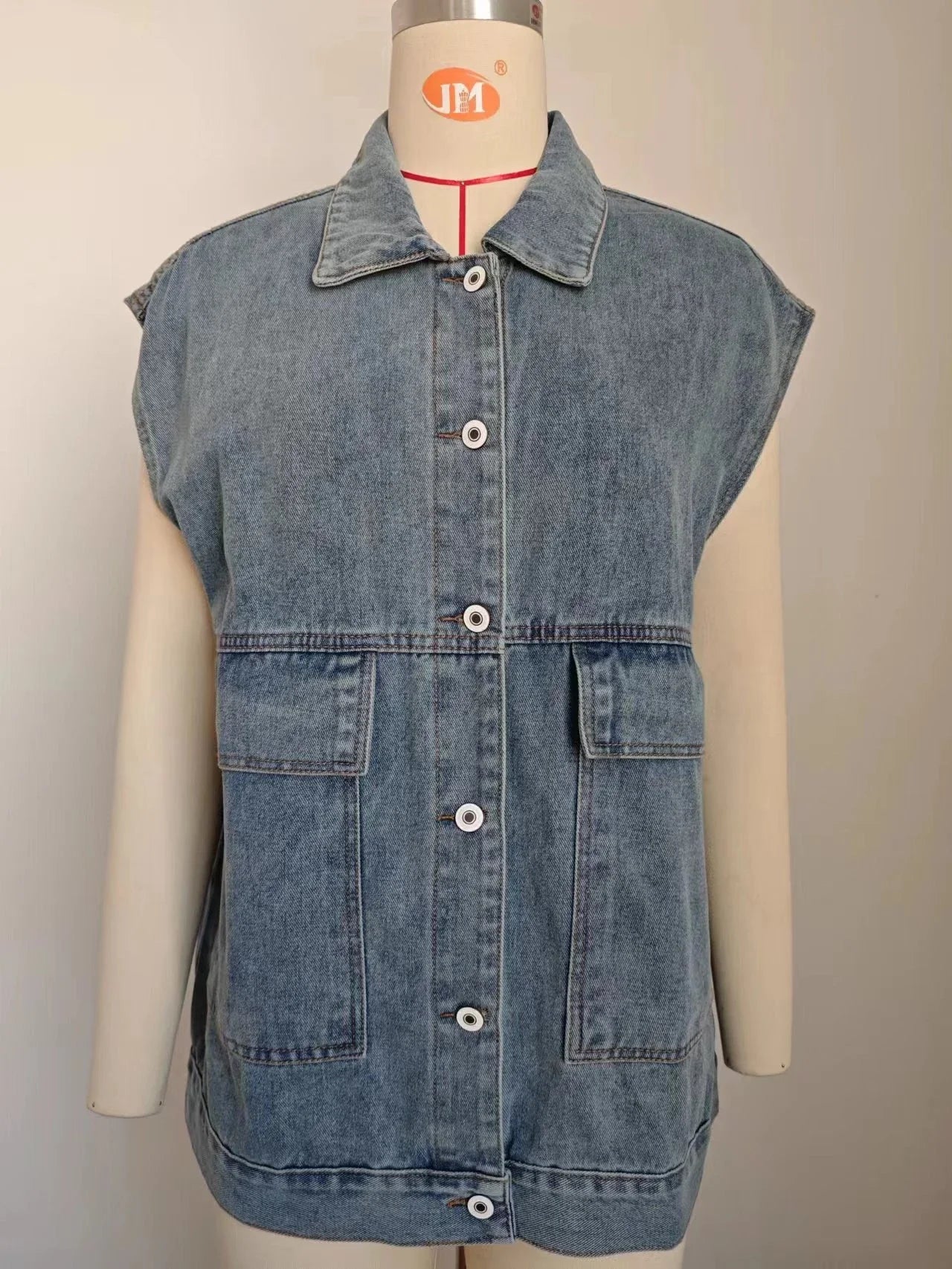 Denim vest with large pockets, sleeveless design for women's casual and formal wear