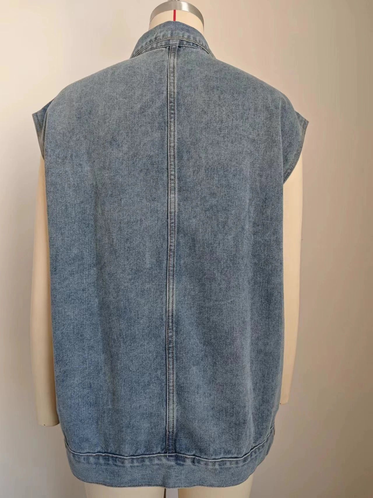 Denim vest with large pockets, sleeveless design for women's casual and formal wear