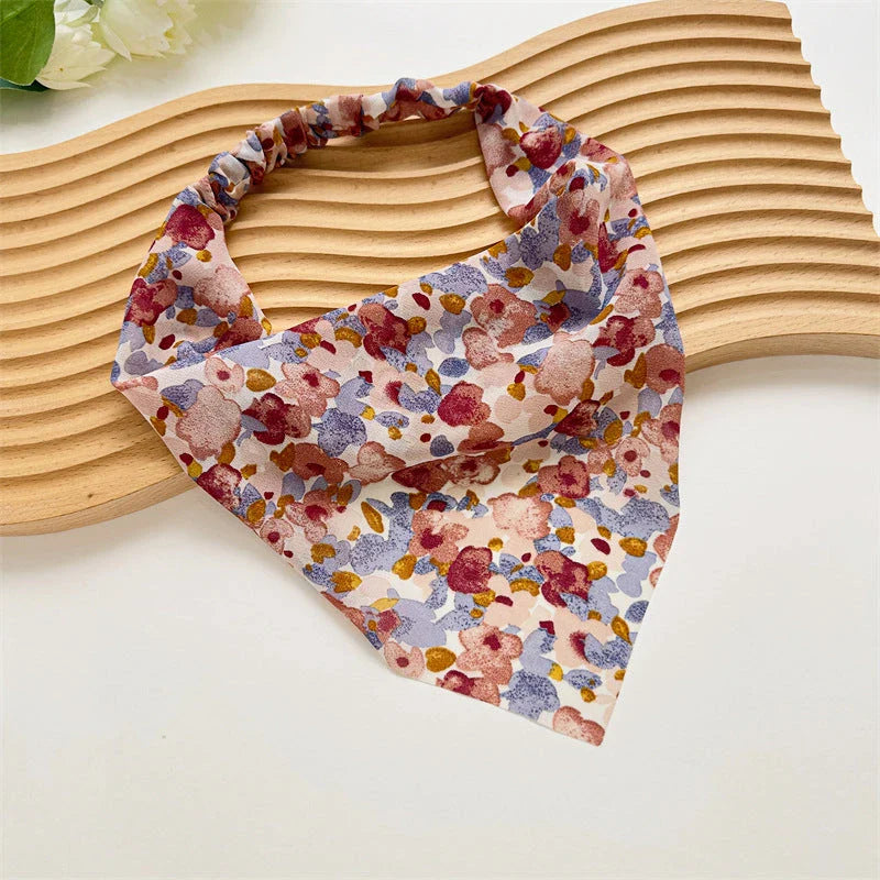 Elegant white satin triangle hair scarf with floral pattern, suitable for versatile styling as a headband, scarf, or bandana