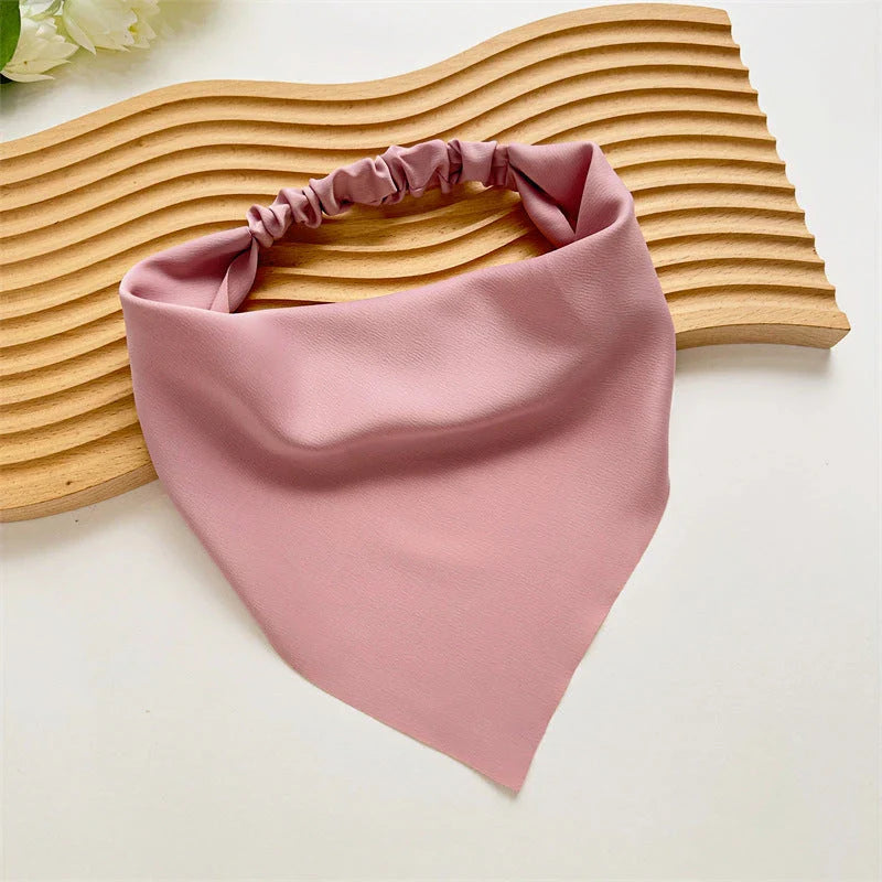 Elegant white satin triangle hair scarf with floral pattern, suitable for versatile styling as a headband, scarf, or bandana