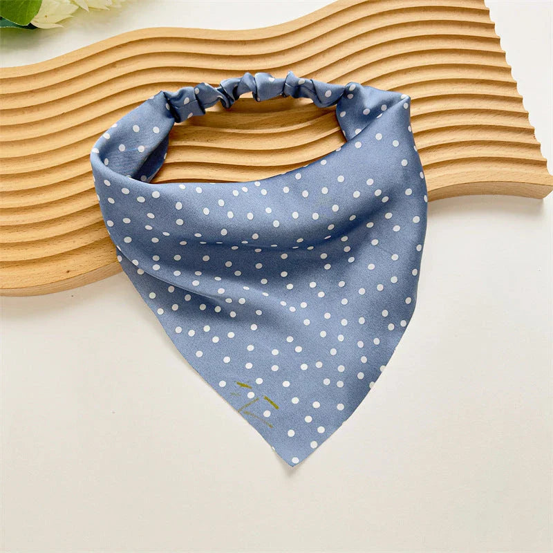 Elegant white satin triangle hair scarf with floral pattern, suitable for versatile styling as a headband, scarf, or bandana