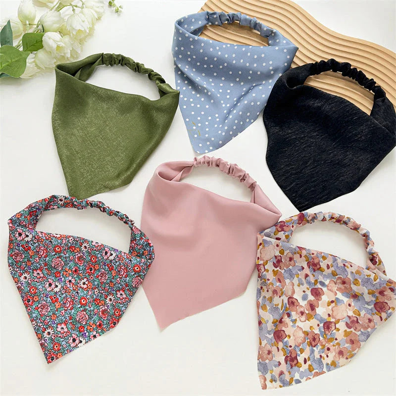 Elegant white satin triangle hair scarf with floral pattern, suitable for versatile styling as a headband, scarf, or bandana