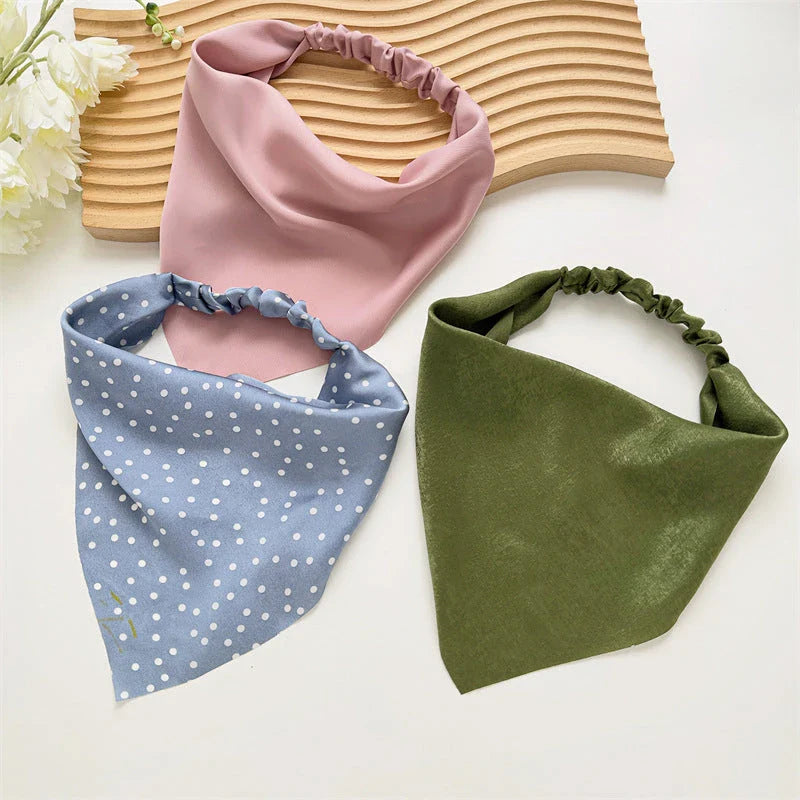 Elegant white satin triangle hair scarf with floral pattern, suitable for versatile styling as a headband, scarf, or bandana