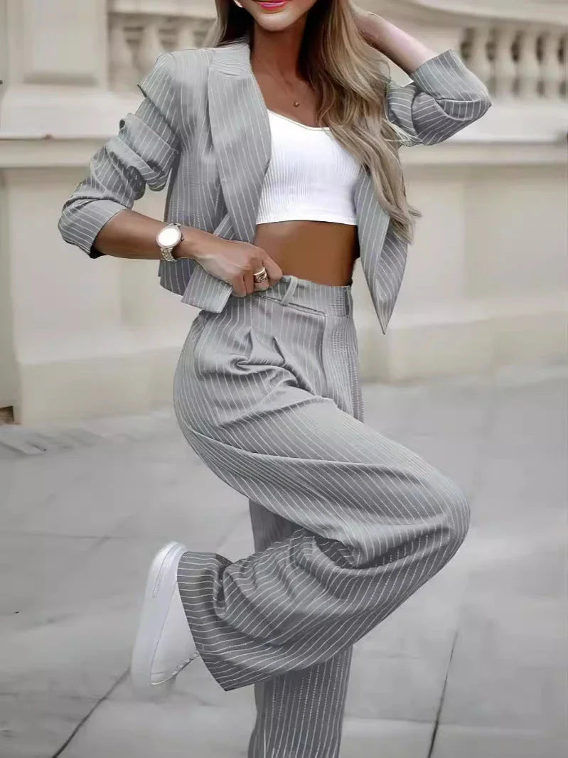 Stylish striped two-piece outfit featuring a cropped top and straight-leg pants in a variety of colors