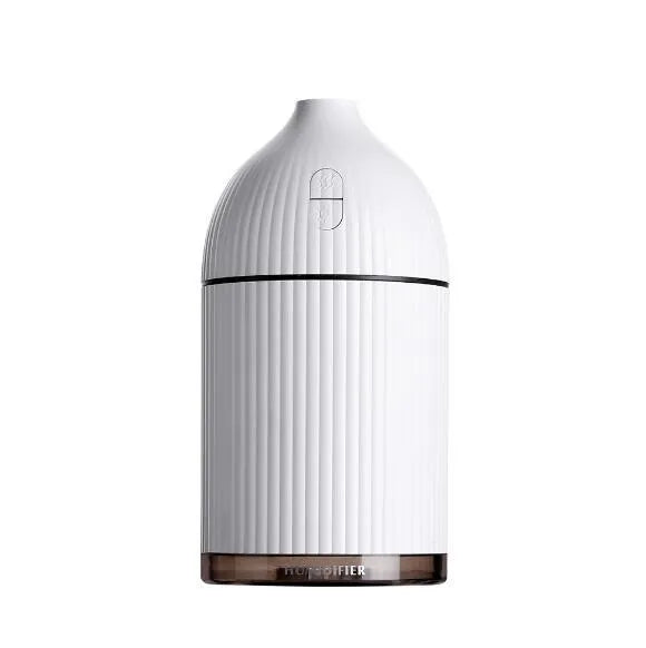 White ultrasonic aromatherapy diffuser and air humidifier with LED light, 300ml capacity, on a desk.