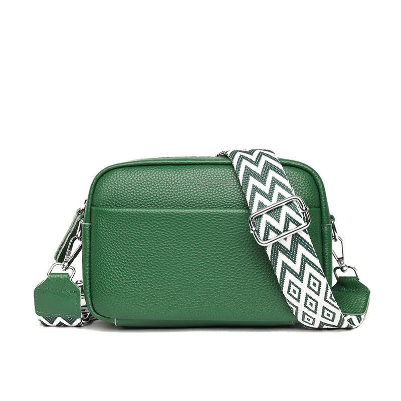 Stylish crossbody bag with rhombus embroidery, wide adjustable shoulder strap, and multiple interior pockets in various color options