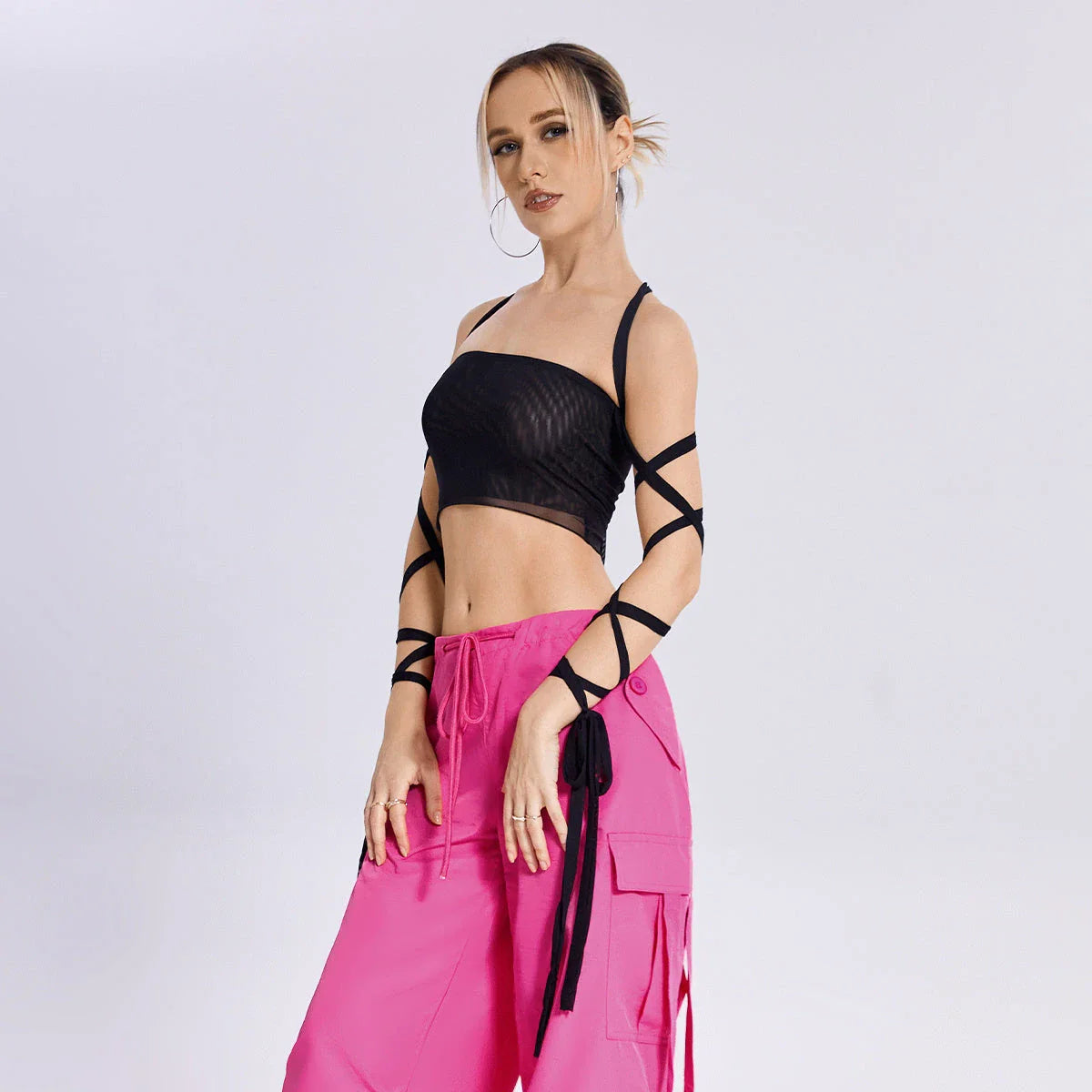 A stylish women's tank top with a trendy cross-back design and premium fabric blend for comfortable and versatile summer wear.