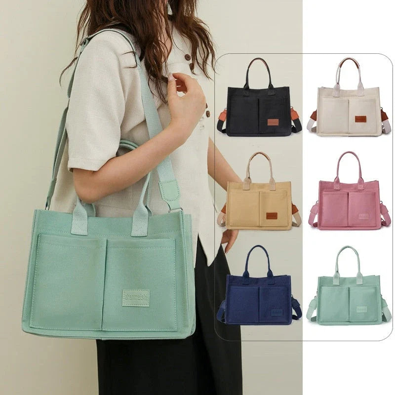Premium canvas tote bag with multiple pockets, adjustable shoulder strap, and stylish design for everyday use