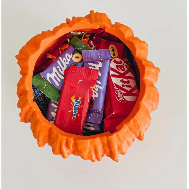 Spooky pumpkin-shaped candy bowl for Halloween decorations and treats