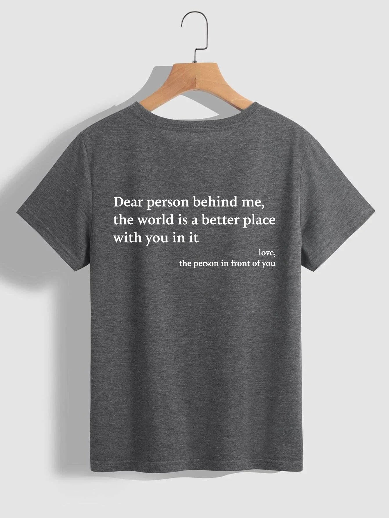 Stylish women's graphic t-shirt with trendy slogan, featuring a vibrant print design and comfortable short sleeve silhouette.