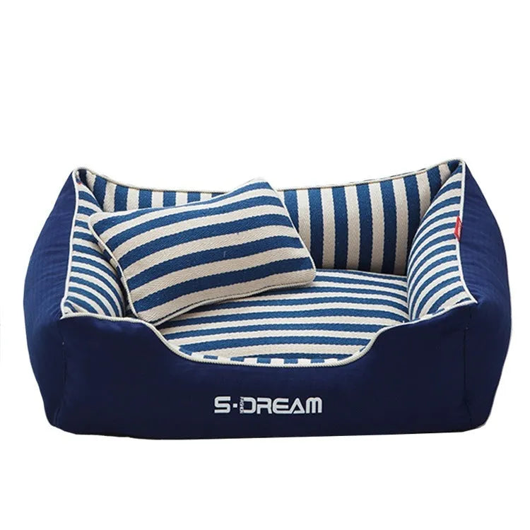 Removable washable dog kennel mat with fabric pillow in navy stripes and blue or red colour options.