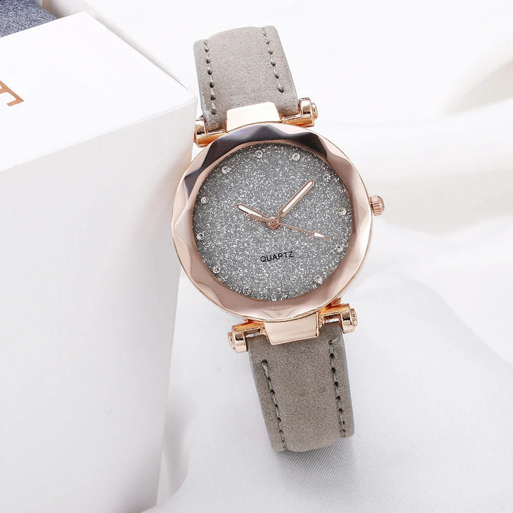 Elegant women's wrist watch with a captivating starry sky dial and leather strap, suitable for any occasion.