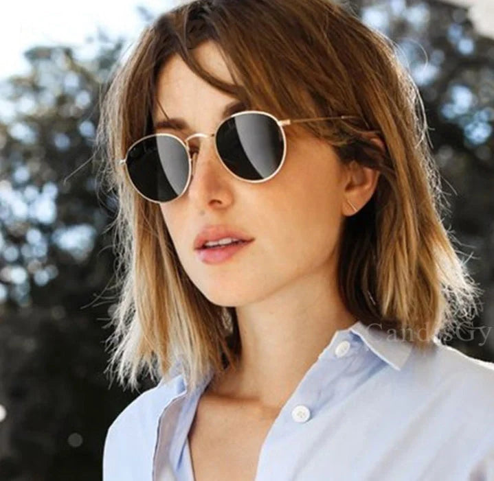 Stylish retro sunglasses for women with metal frame and glass lenses
