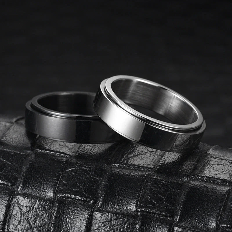 Rotatable stainless steel spinner ring with moon and star designs for anxiety relief and style