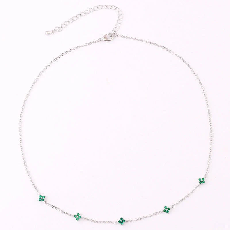Elegant gold and silver floral necklace with adjustable chain and flower charm, perfect for vacation and beach outfits