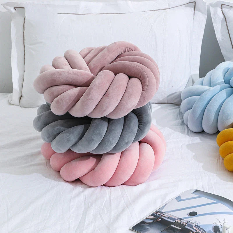 Plush decorative throw pillows with knotted ball design in various colors for living room, bedroom, and photography