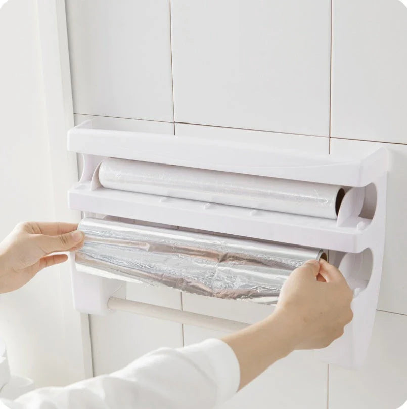 Multifunctional kitchen wall organizer with cling wrap, foil, and paper towel storage compartments and built-in cutting tools
