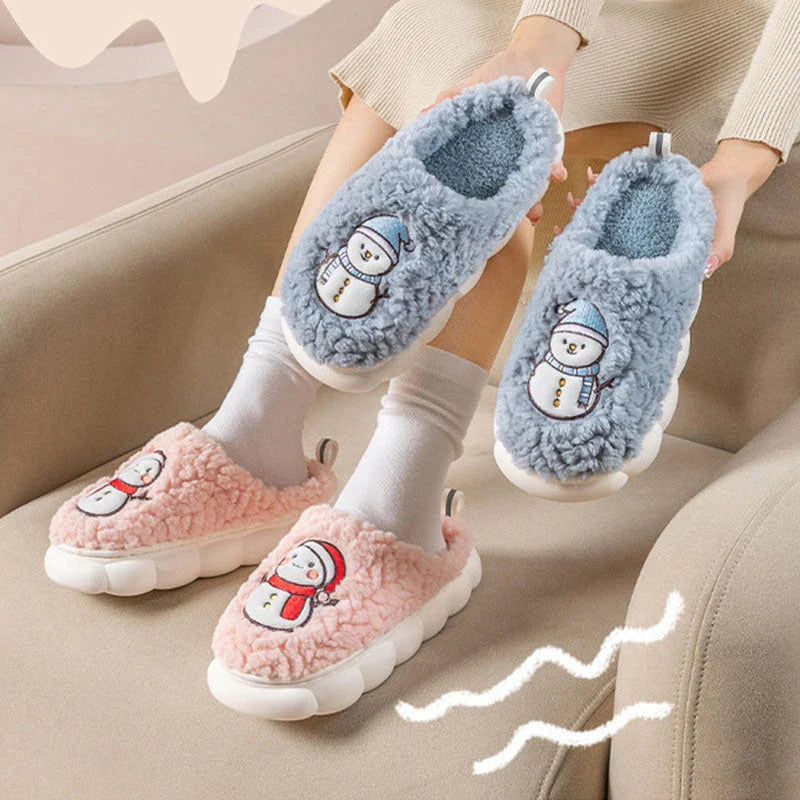 Cozy snowman-themed slippers with plush interior and thick, anti-slip soles for warm, comfortable indoor wear