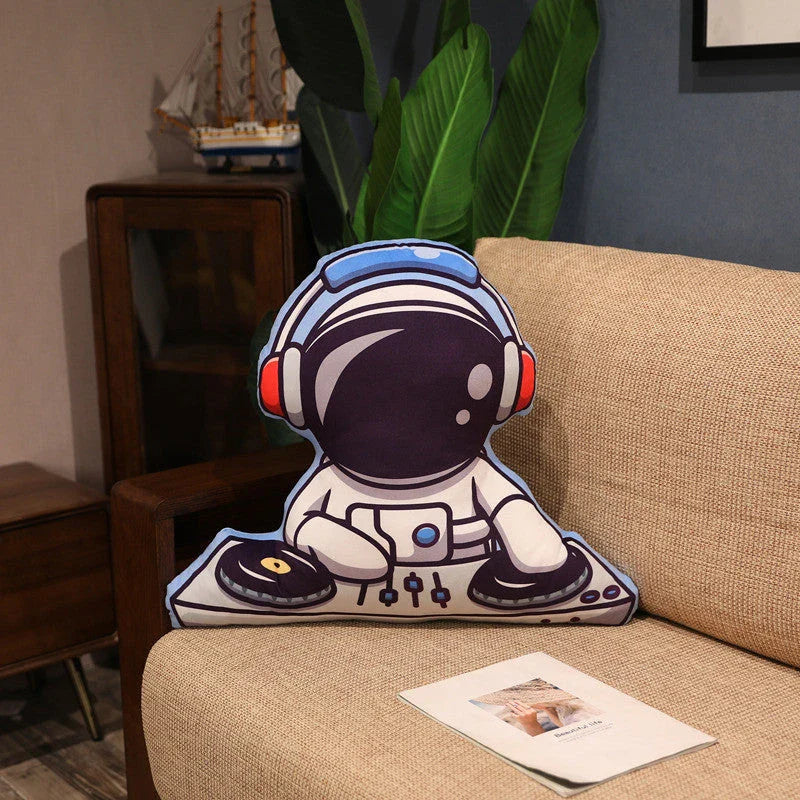Soft plush astronaut pillows in various space-themed designs, including rockets, spacecraft, and more
