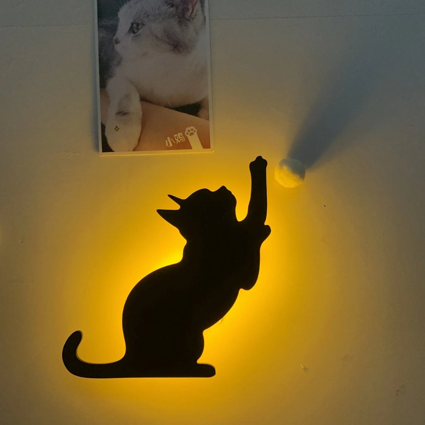 A stylish cat-themed LED lamp that automatically lights up when it detects sound, creating a cozy, ambient glow in a room.