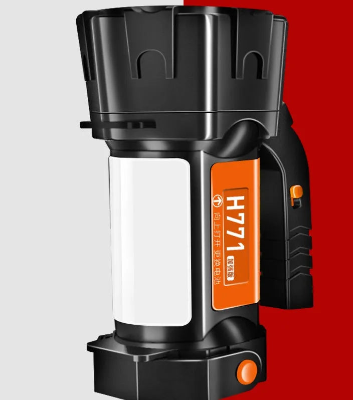 H771 portable LED searchlight in orange or green with shoulder strap and removable battery.
