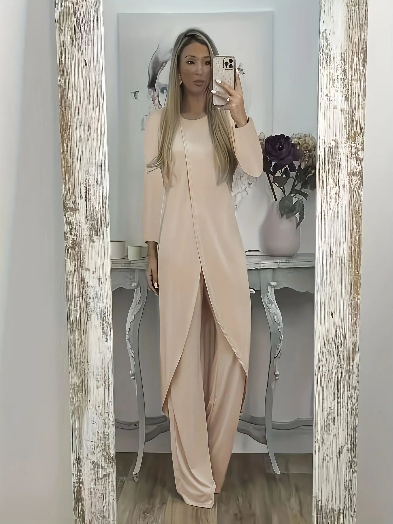 Black loose-fit polyester two-piece lounge set with long sleeves and matching trousers