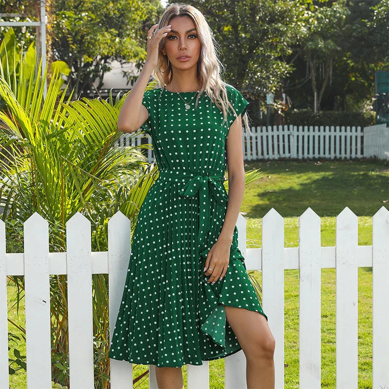 A classic polka dot midi dress with a buttoned style, perfect for summertime
