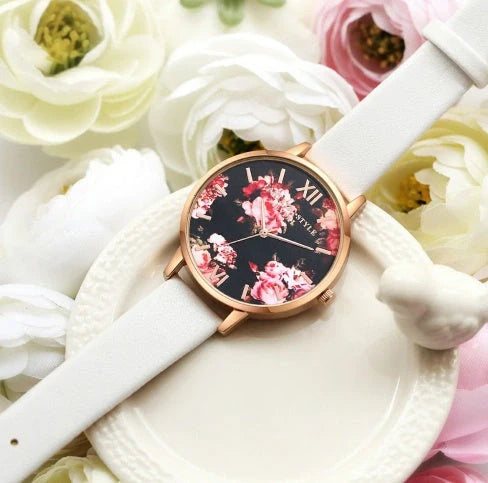 Elegant rose gold women's watch with leather strap and love heart design