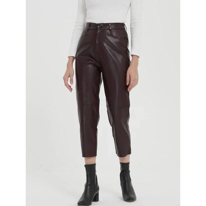 Elegant faux leather pants with high waist and ankle-length design, perfect for office or casual wear.