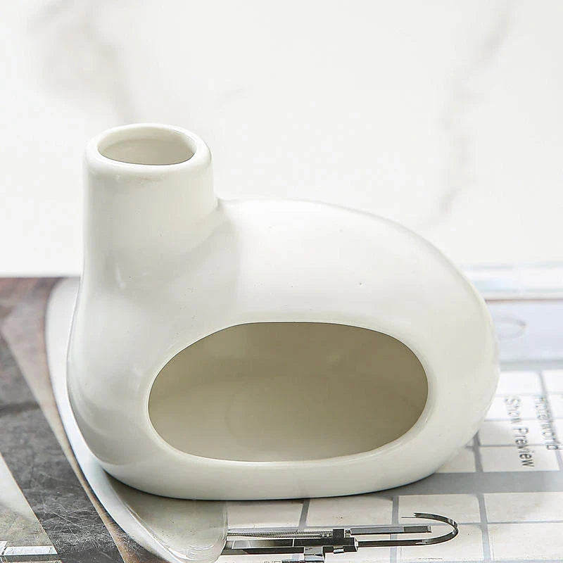 Elegant and modern ceramic incense burner with Palo Santo wood holder, designed to enhance your living space with a calming aroma.
