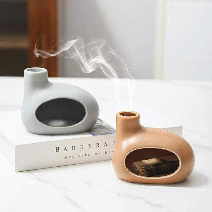 Elegant and modern ceramic incense burner with Palo Santo wood holder, designed to enhance your living space with a calming aroma.