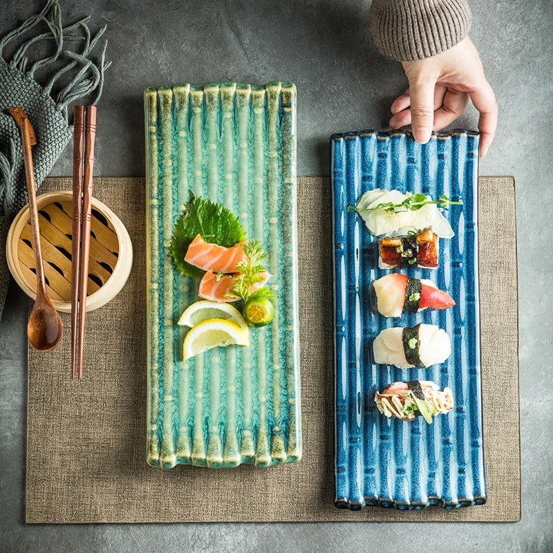 A rectangular ceramic plate with a beautiful kiln-baked blue finish, perfect for serving pizzas, cheese boards, and more.
