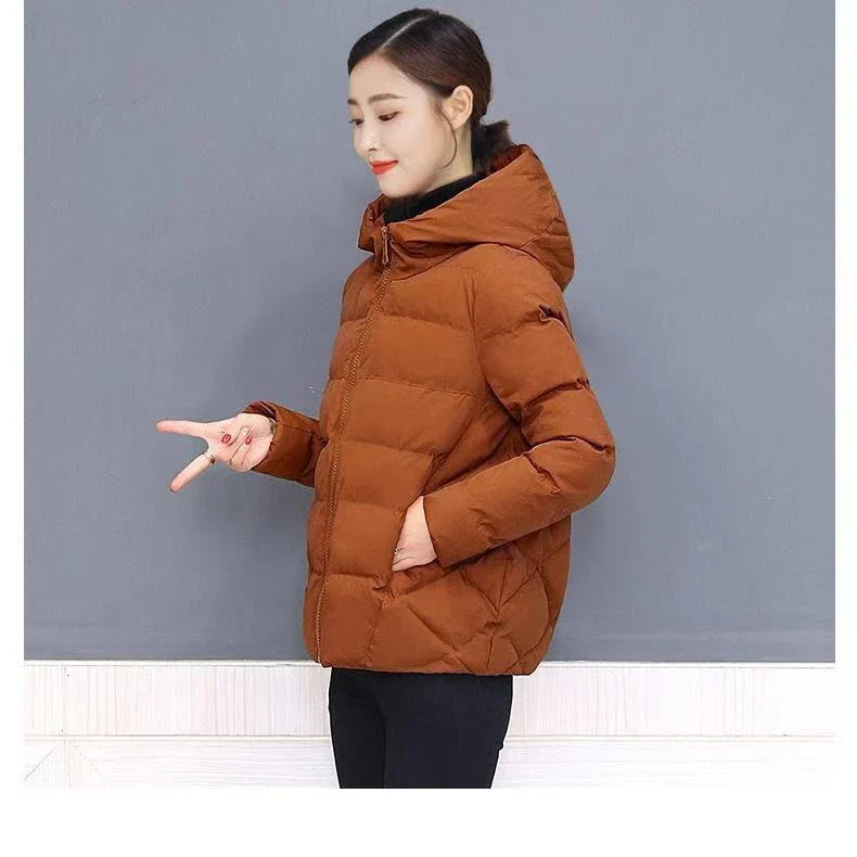 A cosy and stylish cotton bread suit with a relaxed, hooded silhouette available in a range of classic colours.