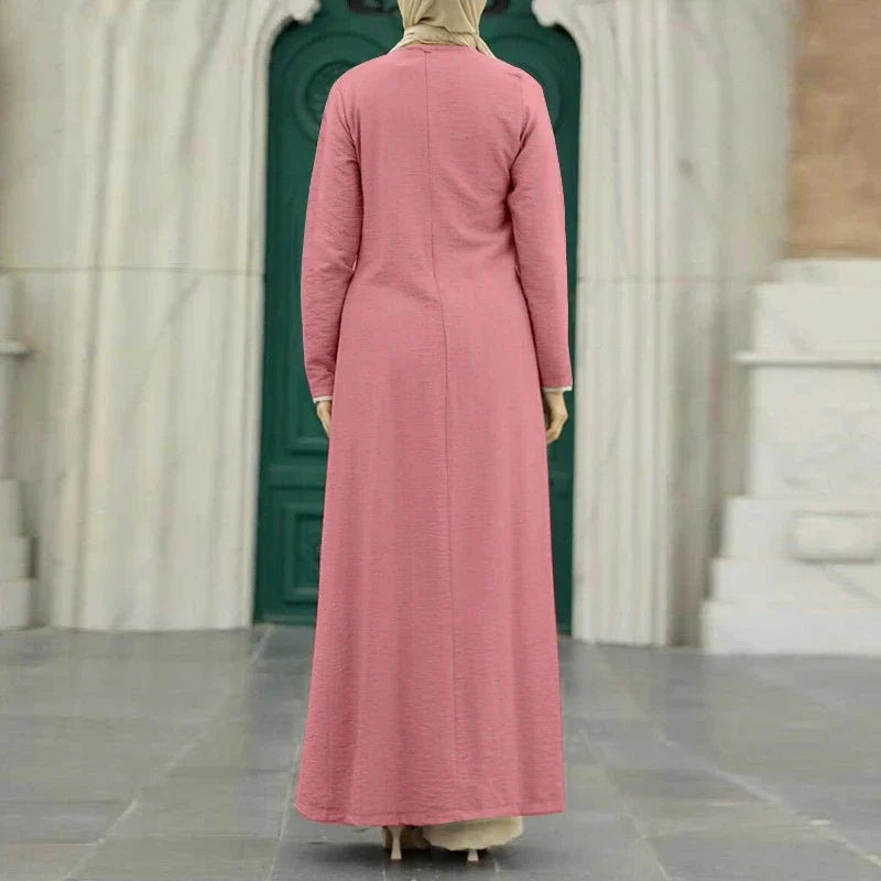 Muslim women's dress made of elegant ice silk fabric with long sleeves and high slit hem, available in various colours