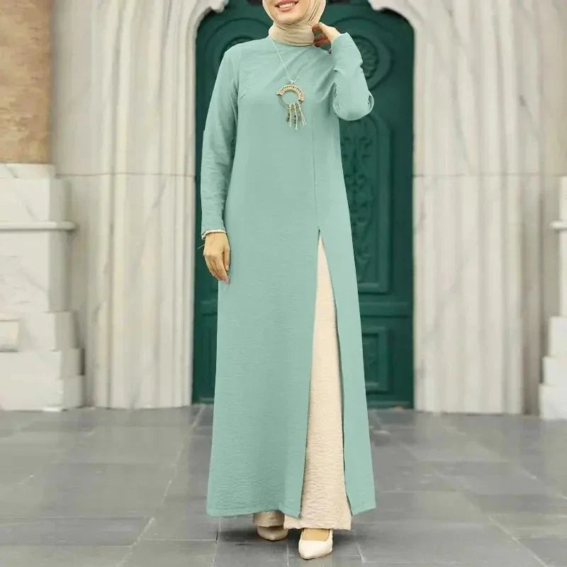 Muslim women's dress made of elegant ice silk fabric with long sleeves and high slit hem, available in various colours