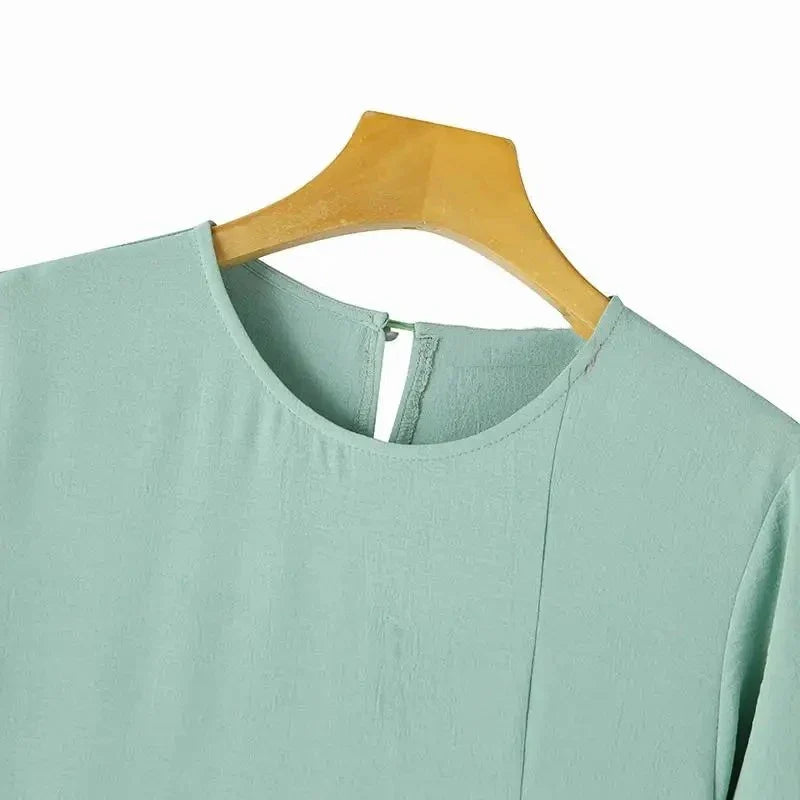 Muslim women's dress made of elegant ice silk fabric with long sleeves and high slit hem, available in various colours