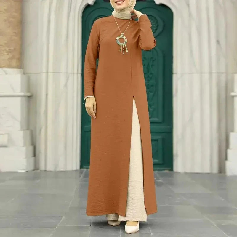 Muslim women's dress made of elegant ice silk fabric with long sleeves and high slit hem, available in various colours