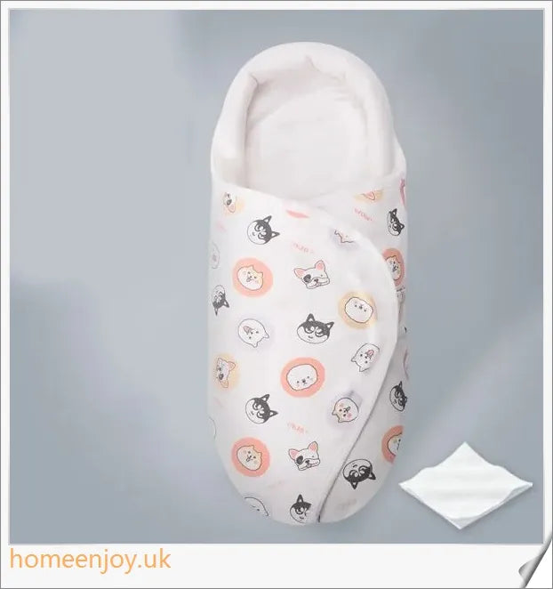 A cozy, snug baby swaddle with soft cotton fabric and velcro closures to provide comfort and security for newborns.