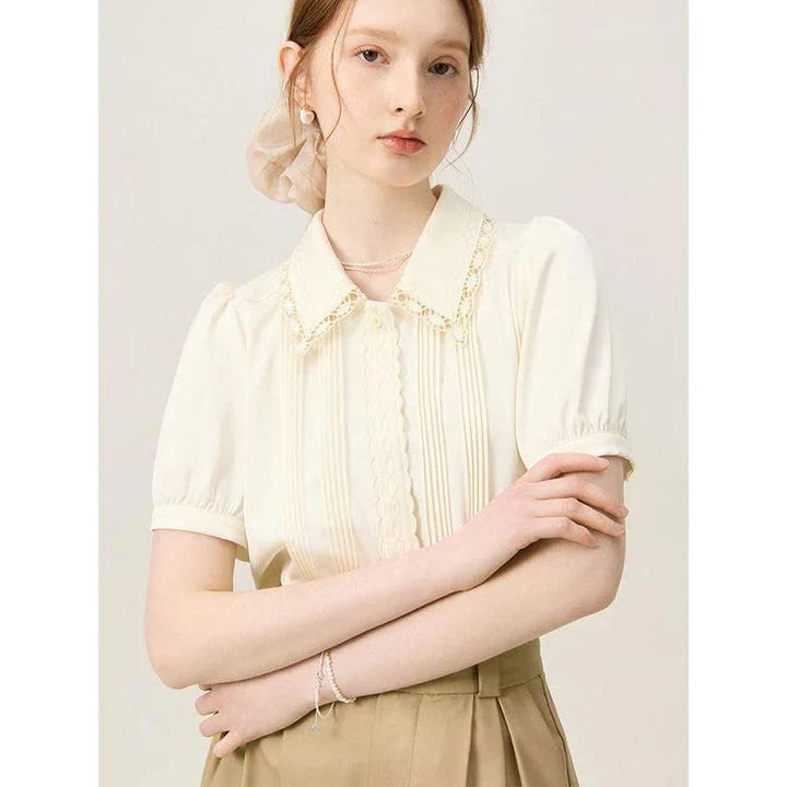Elegant summer embroidered polo-neck blouse with petal sleeves in ivory colour