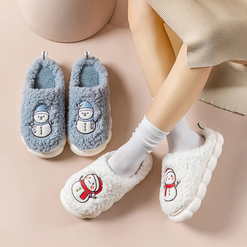 Cozy snowman-themed slippers with plush interior and thick, anti-slip soles for warm, comfortable indoor wear