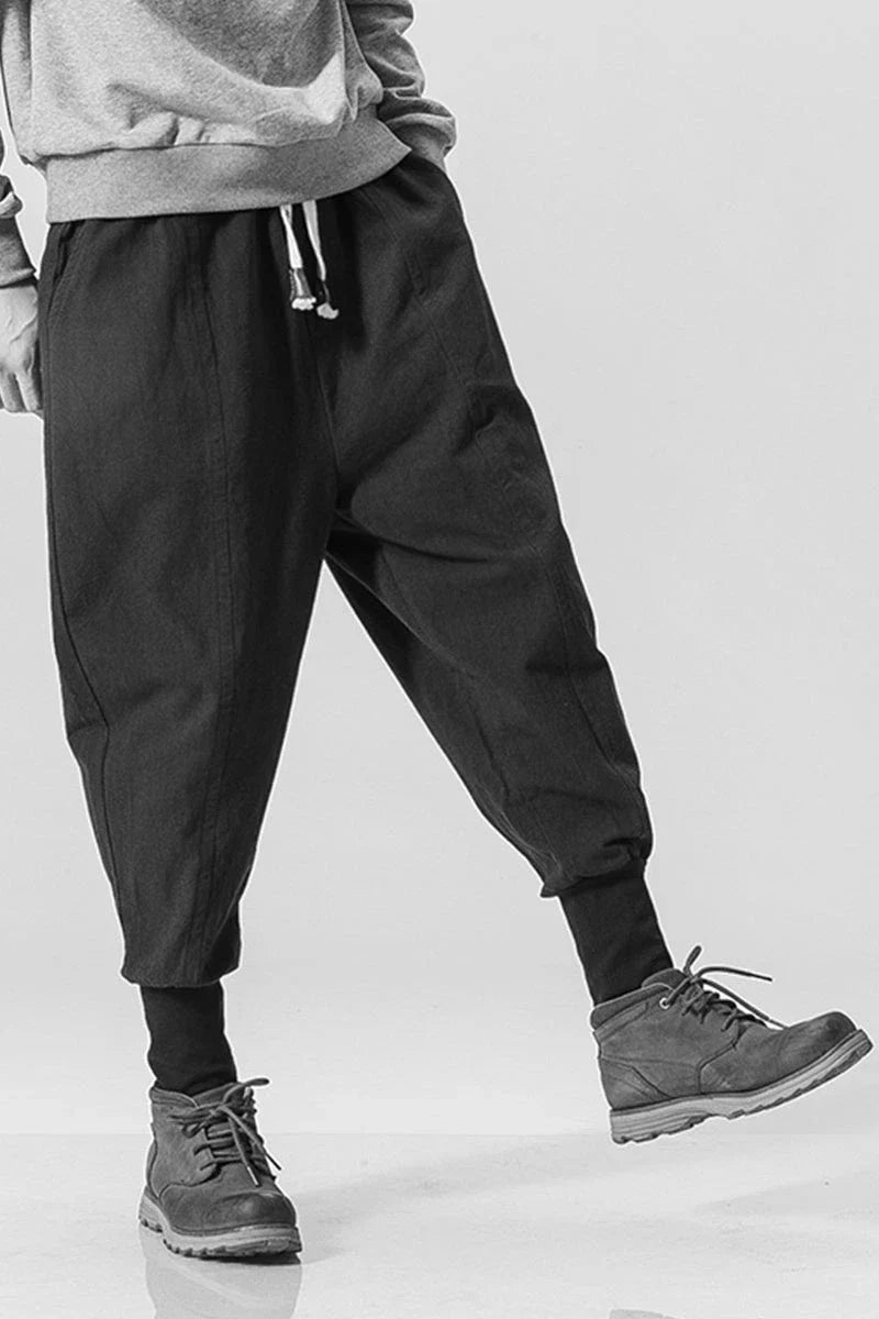 Men's harem trousers made of soft cotton and linen, featuring an elastic waistband and relaxed silhouette for all-day comfort.