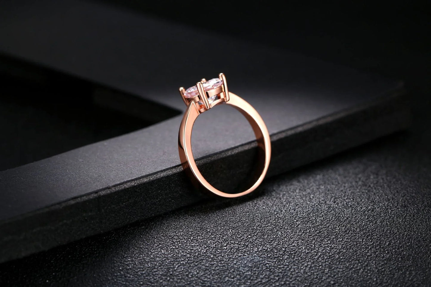 Close-up of a beautiful rose gold ring with sparkling zircon stones