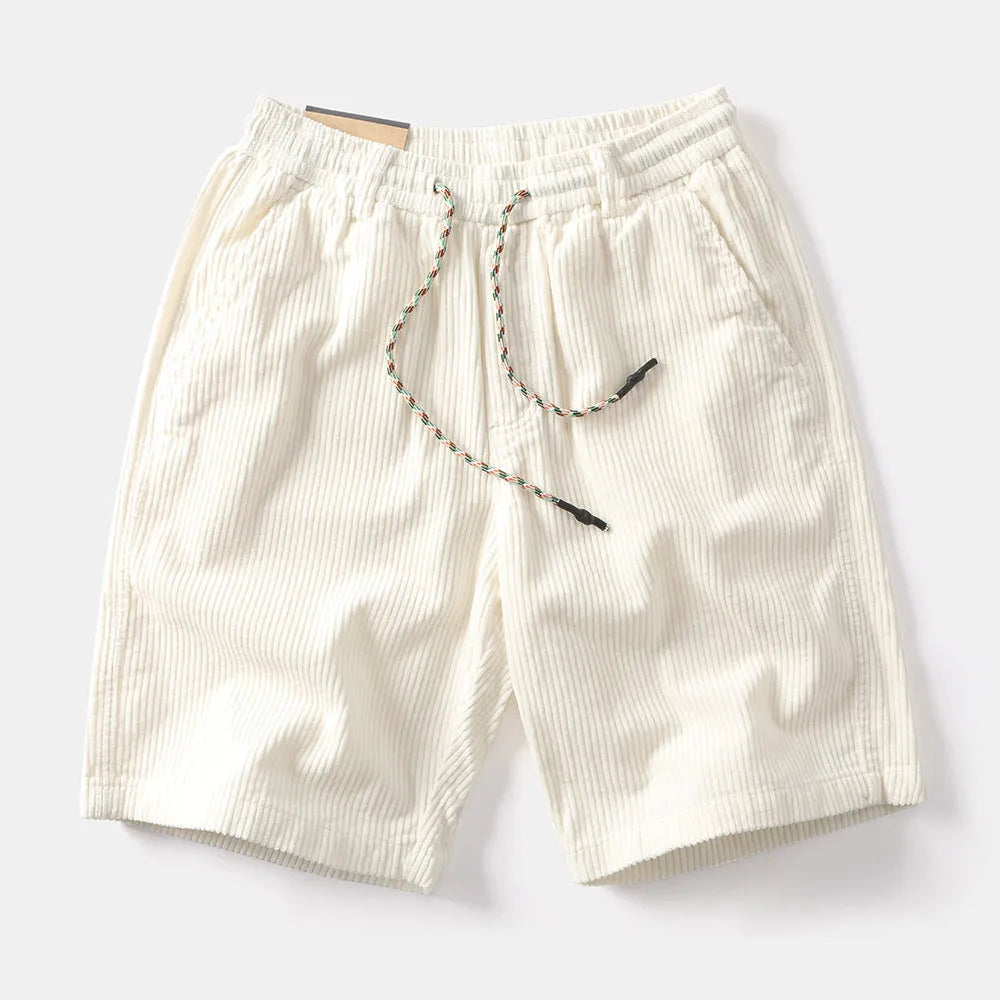 Men's khaki retro cargo shorts with straight legs and multiple pockets on a plain background.