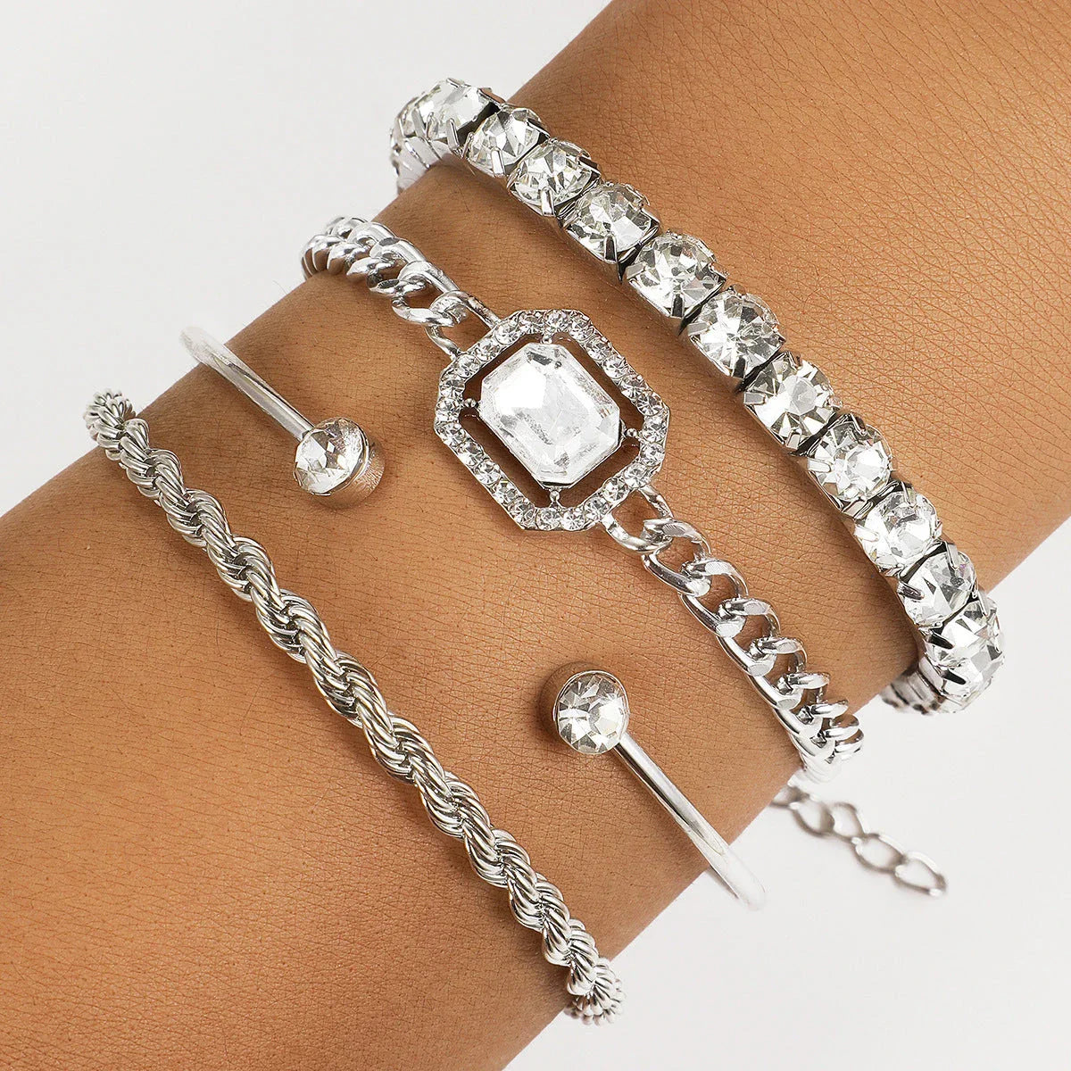 4-piece crystal bracelet set with boho-chic design, featuring sparkling rhinestones and adjustable alloy construction
