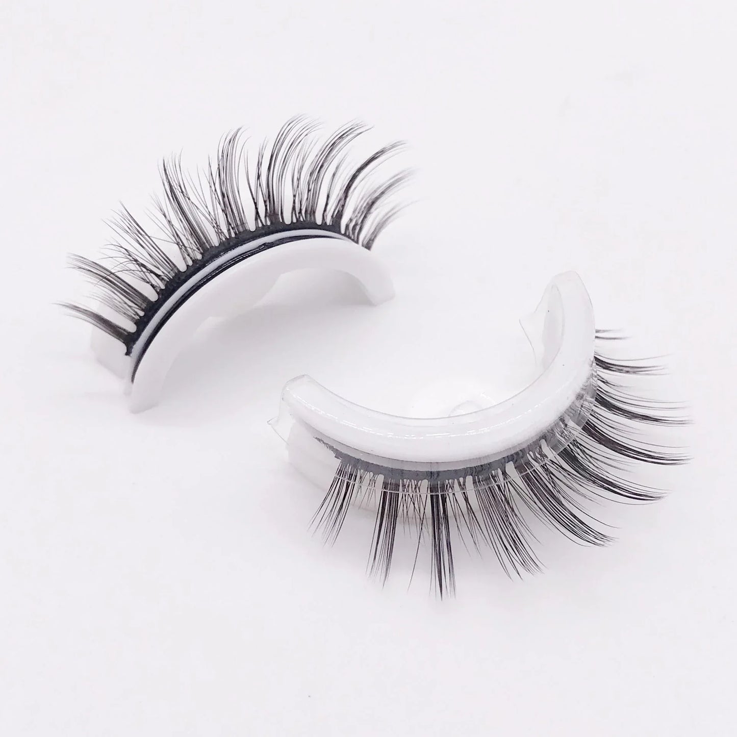 Glamorous 3D mink-inspired false eyelashes in various styles and packaging