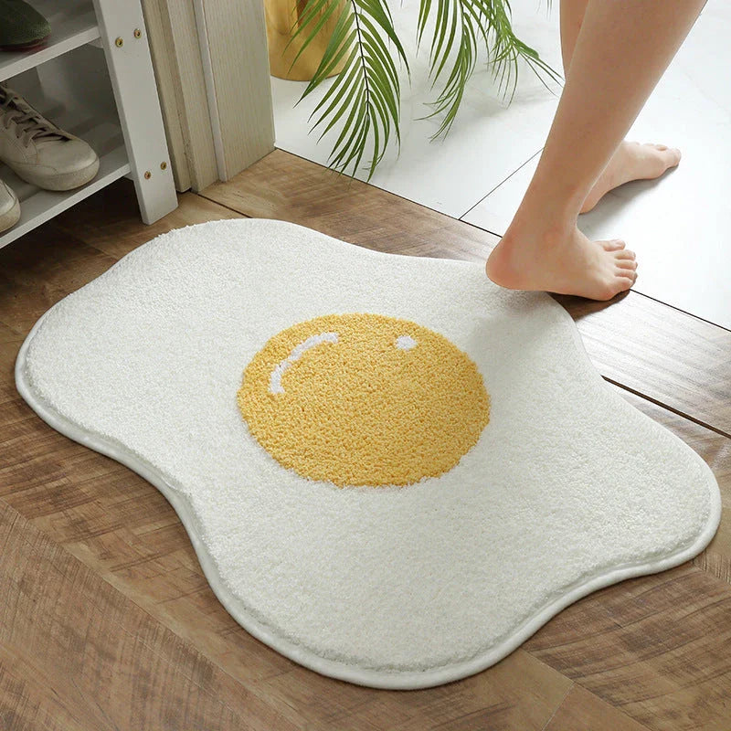 Stylish and absorbent egg-shaped doormat in various sizes and colors, made of plush polyester with a non-slip rubber backing