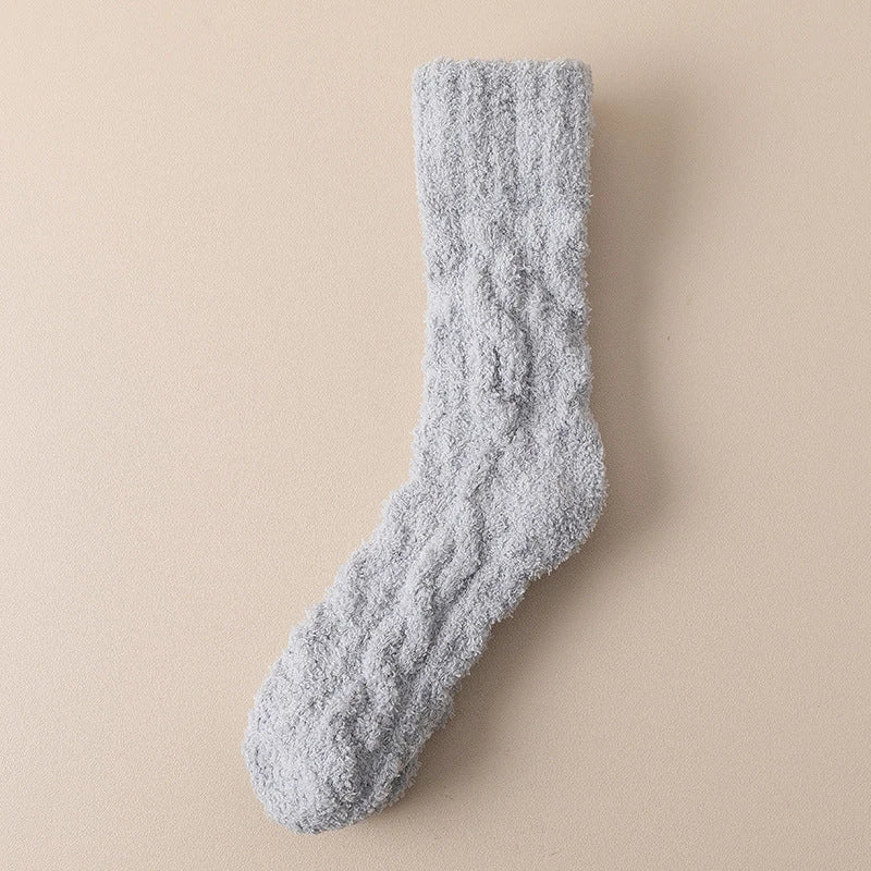 Plush coral fleece socks in various colors, designed for cozy and comfortable home wear