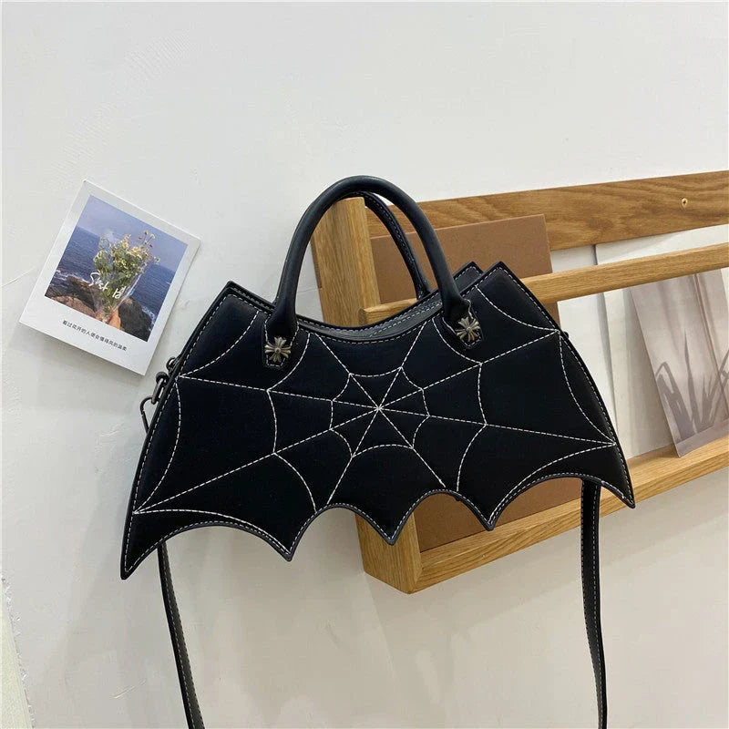 A stylish Halloween shoulder bag with a captivating spider web design, made of durable PU leather and offering ample storage space.