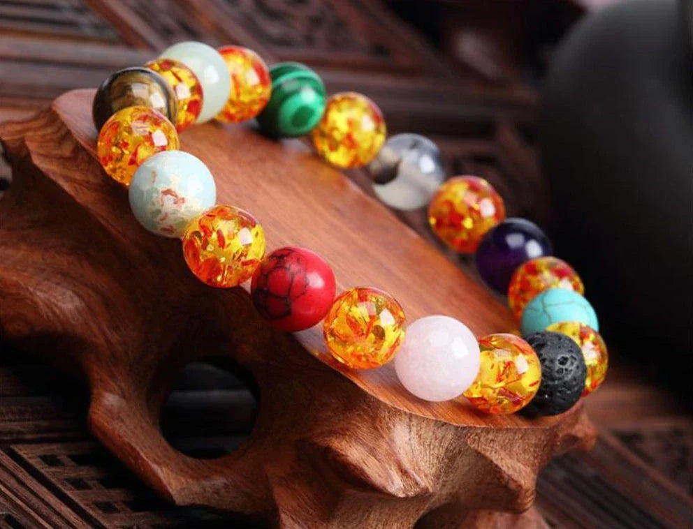 Handcrafted beaded bracelet with seven chakra-representing beads, designed to promote balance and well-being.