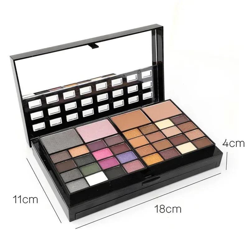Open 74 colour makeup combination palette showing four layers of eyeshadow, lip gloss, blush and contour powders with brushes.